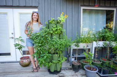 Growing in vertical towers is perfect for small spaces. They make the most out of any spot, and enable you to grow anything! This tower is filled with herbs and is close to the kitchen for easy access