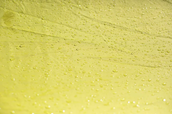 Natte Doek Druppels Gele Stof Natte Luifel Uit Regen — Stockfoto
