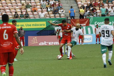 (SPO) Brezilya Futbol Şampiyonası 3. Lig: Manaus ve Tombense-MG. Manaus ile Tombense-MG arasında Brezilya Futbol Şampiyonası 3. Ligi için 30 Cumartesi günü Manaus 'taki Arena da Amazania Stadyumu' nda oynanan futbol maçı.). 