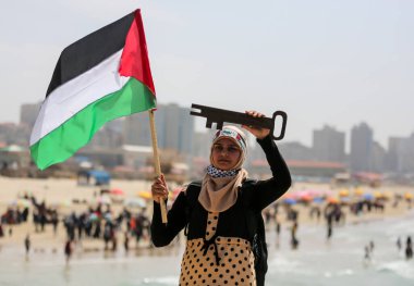 Filistinliler Gazze Şeridi 'nde Dünya Günü' nün 46. yıldönümünü kutluyor. 30 Mart 2022, Gazze, Filistin: Filistinliler, 30 Mart Çarşamba günü Gazze Limanı 'nda, Dünya Günü 