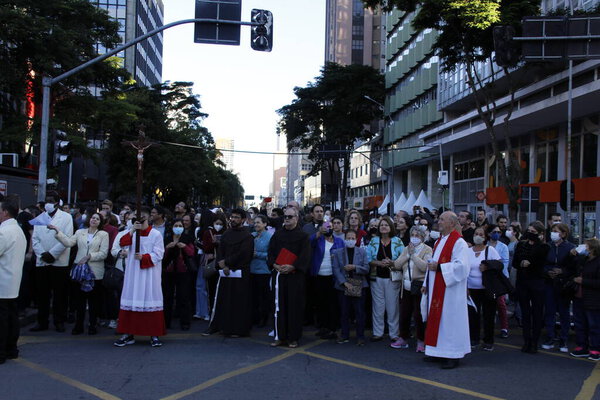 Faithful accompany traditional Holy Friday Procession in Curitiba. April 15, 2022, Curitiba, Parana, Brazil: Processions from different sanctuaries, such as Guadalupe and Perpetuo Soccoro, take to the streets of downtown Curitiba