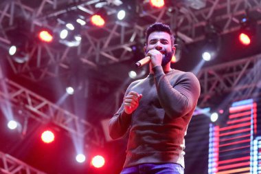 Brezilyalı şarkıcı Gustavo Lima, Sao Paulo 'da canlı performans sergiliyor. 11 Haziran 2022, Votarantim, Sao Paulo, Brezilya: Brezilyalı şarkıcı Gustavo Lima, Votorantim, Sao Paulo 'da düzenlenen hayır etkinliği Haziran ayında düzenlenen festivalde canlı performans sergiliyor..