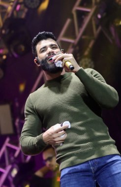 Brezilyalı şarkıcı Gustavo Lima, Sao Paulo 'da canlı performans sergiliyor. 11 Haziran 2022, Votarantim, Sao Paulo, Brezilya: Brezilyalı şarkıcı Gustavo Lima, Votorantim, Sao Paulo 'da düzenlenen hayır etkinliği Haziran ayında düzenlenen festivalde canlı performans sergiliyor..