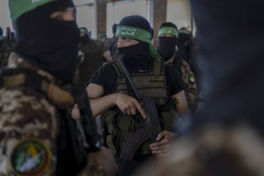 Hamas holds military parade to remember Israel's 2014 offensive. July 20, 2022, Gaza  Strip, Palestine: Brigadiers from Al-Qassam, the military wing of the Islamic resistance movement Hamas clipart