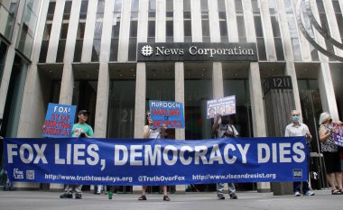 (NEW) Protest against Fox News- Fox Lies, Democracy Dies. July 26, 2022, New York, USA: Few protesters gathered in front of Fox TV news building on 6th avenue protesting against the station for not airing January 6th committee hearings 
