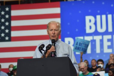 US President Joe Biden delivers remarks at a rally for the 2022 midterm elections at Richmond Montgomery High School. August 25, 2022, Rockville, Maryland, USA: US President Joe Biden, Democratic officials, and voters rallied at a DNC event   clipart