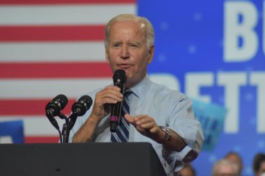 US President Joe Biden delivers remarks at a rally for the 2022 midterm elections at Richmond Montgomery High School. August 25, 2022, Rockville, Maryland, USA: US President Joe Biden, Democratic officials, and voters rallied at a DNC event   clipart