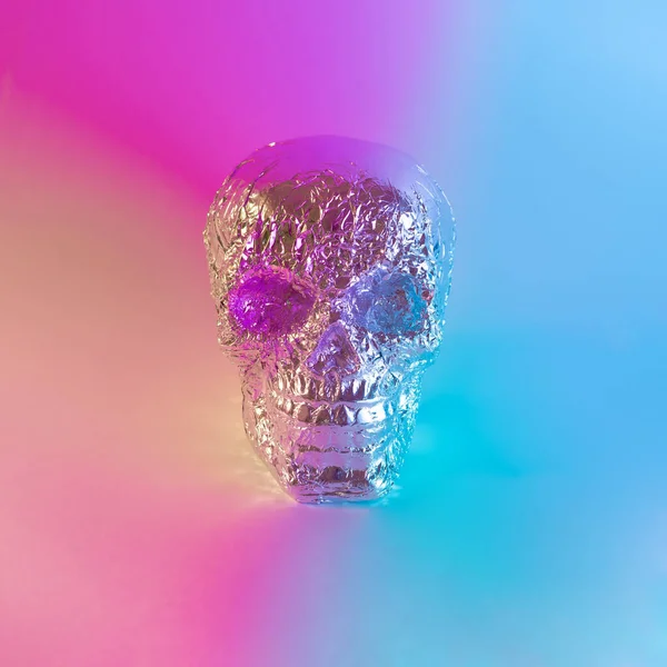 Skull with vibrant neon purple, blue and yellow color lights. Minimal Halloween retro futuristic concept.