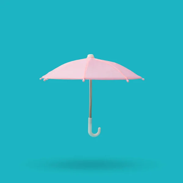 Pink Umbrella Metal Plastic Handle Blue Background — Foto Stock