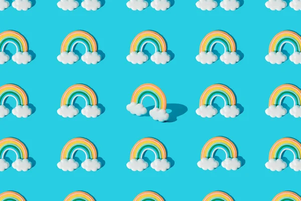 Small colorful rainbow cookie with clouds. Pattern.