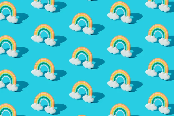 Small colorful rainbow cookie with clouds. Pattern.