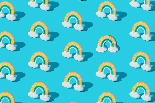 Small Colorful Rainbow Cookie Clouds Pattern Blue Background — Stock Fotó