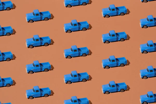 Blue pickup truck on a brown background. Pattern.