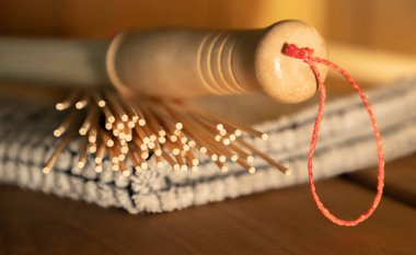 Bamboo broom close up. Sauna accessories in the steam room