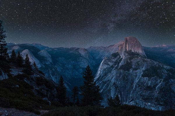 Scenic night sky above the famous Half Dome mountain, Yosemite NP, USA