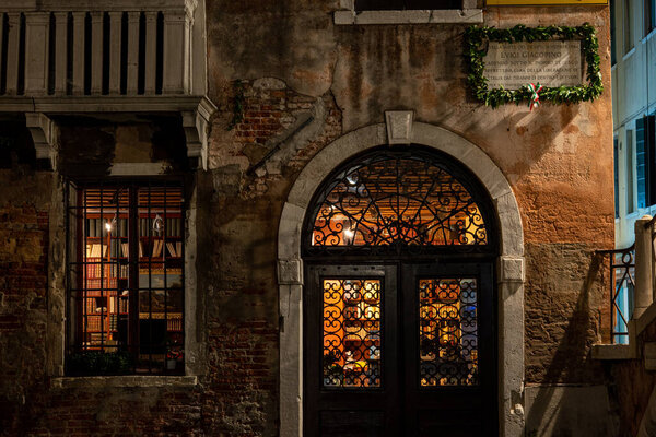 An old Book Store illuminated at Night, Venice, Italy
