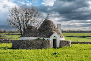 Scenic Trullo dwelling in the rural landscape near Alberobello, Southern Italy