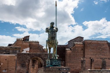 Beautiful statue of an ancient lancer on the forum of the ancient city of Pompeii, Southern Italy