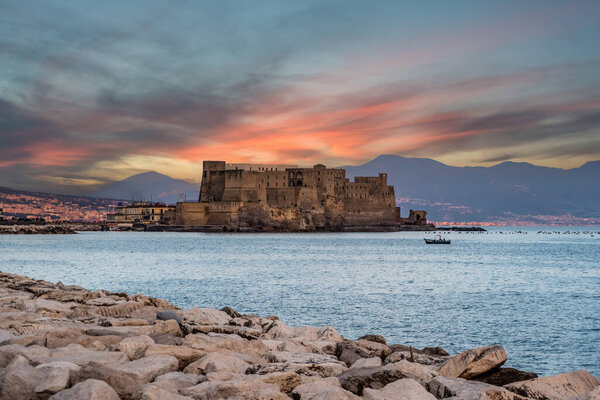 Sunrise over iconic Castel dell'Ovo and the Gulf of Naples, Southern Italy