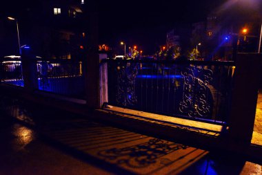 MARMARIS, MUGLA, TURKEY: Beautiful openwork decorative fence at the canal bridge in the city center with blue illumination at night in Marmaris.