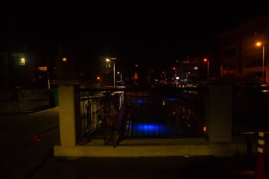 MARMARIS, MUGLA, TURKEY: Beautiful openwork decorative fence at the canal bridge in the city center with blue illumination at night in Marmaris.