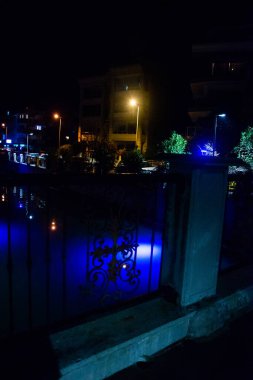 MARMARIS, MUGLA, TURKEY: Beautiful openwork decorative fence at the canal bridge in the city center with blue illumination at night in Marmaris.