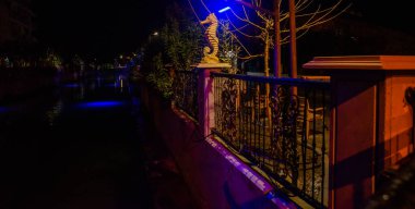 MARMARIS, MUGLA, TURKEY: Sculpture of a Seahorse on the street by the canal in Marmaris at night.