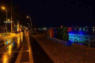 MARMARIS, MUGLA, TURKEY: Huge letters, the name and the sign of Marmaris on the promenade at night in the Turkish city of Marmaris
