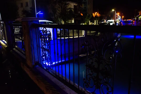 MARMARIS, MUGLA, TURKEY: Beautiful openwork decorative fence at the canal bridge in the city center with blue illumination at night in Marmaris.
