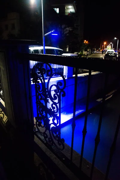 MARMARIS, MUGLA, TURKEY: Beautiful openwork decorative fence at the canal bridge in the city center with blue illumination at night in Marmaris.
