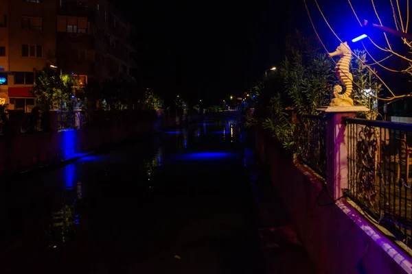 MARMARIS, MUGLA, TURKEY: Sculpture of a Seahorse on the street by the canal in Marmaris at night.