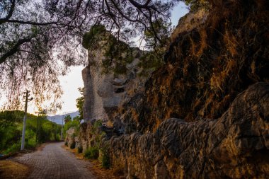 CAMYUVA, KEMER, TURKEY: TDecorative mountain on the territory of an abandoned hotel Holiday Area Eco Dream Club Sea Resort in the forest.