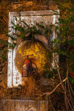 CAMYUVA, KEMER, TURKEY: A huge crane on the territory of an abandoned hotel Holiday Area Eco Dream Club Sea Resort in the forest.