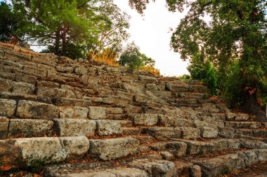 PHASELIS, KEMER, TURKEY: Ruins of the amphitheatre of the ancient city on a cloudy day of Phaselis in Turkey, Antalya province, near Kemer.