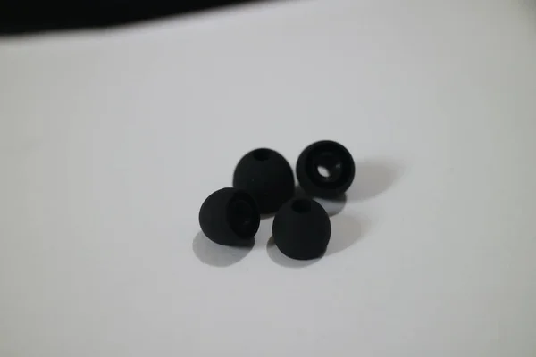 Some Small Black Earphone Rubber Photo — Stock Photo, Image