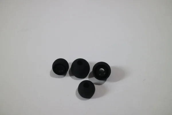 Some Small Black Earphone Rubber Photo — Stock Photo, Image