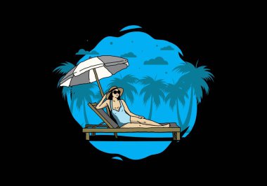 Şemsiye tasarımı altındaki plaj sandalyesinde rahatla.