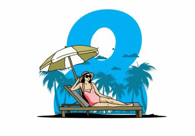 Şemsiye tasarımı altındaki plaj sandalyesinde rahatla.