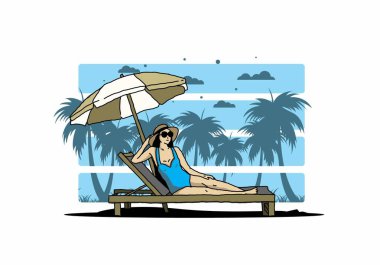 Şemsiye tasarımı altındaki plaj sandalyesinde rahatla.