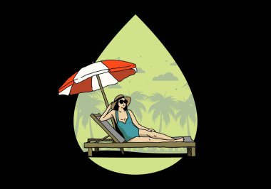 Şemsiye tasarımı altındaki plaj sandalyesinde rahatla.