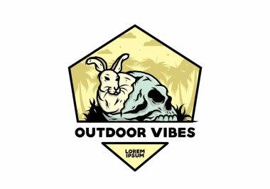 İnsan kafatasının içinde saklanan tavşan tasarımı.