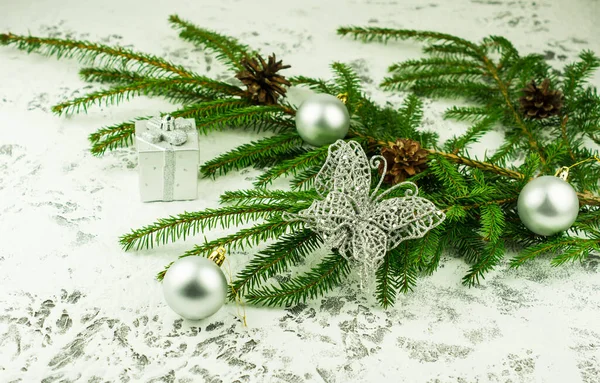 Christmas Decoration Holiday Green Spruce Branch Silver Balls Sparkling Butterfly — Stock Photo, Image