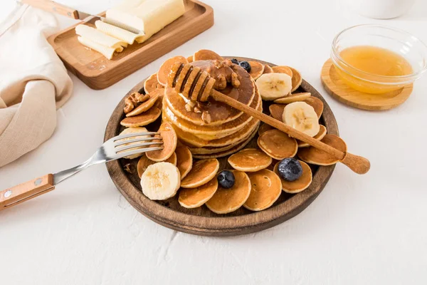 Homemade Pancakes Wooden Plate Banana Slices Walnuts Berries Honey Bowl — Stock Photo, Image