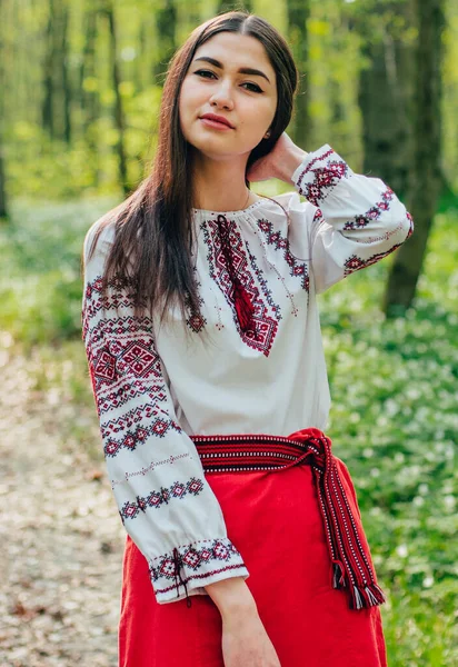 portrait of young beautiful Ukrainian woman in vyshyvanka - ukrainian national clothes. Stand with Ukraine