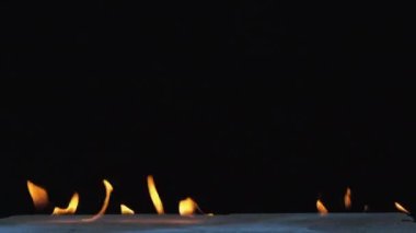 The fire is burning on a brick