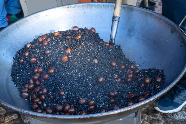 How to roast chestnuts by manual labor. Chestnut is a popular legume in Asia.