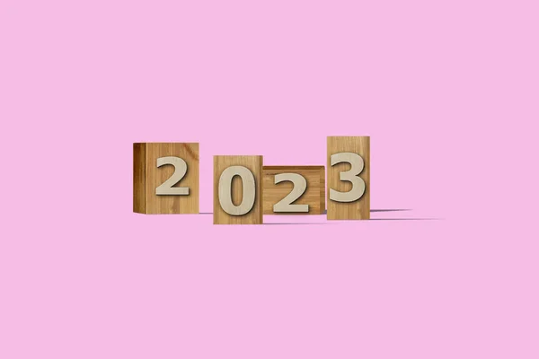 3Dイラスト新年のコンセプト2023ピロエットの色の背景に木の箱にテキストとデザイン — ストック写真