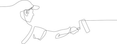 İnsan eli boya fırçalarını boya kutusuyla tutar.