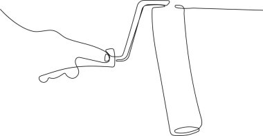 İnsan eli kirli boya silindirini tutuyor.