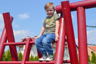 Modern children playground in park. Made in different colors. High quality photo.